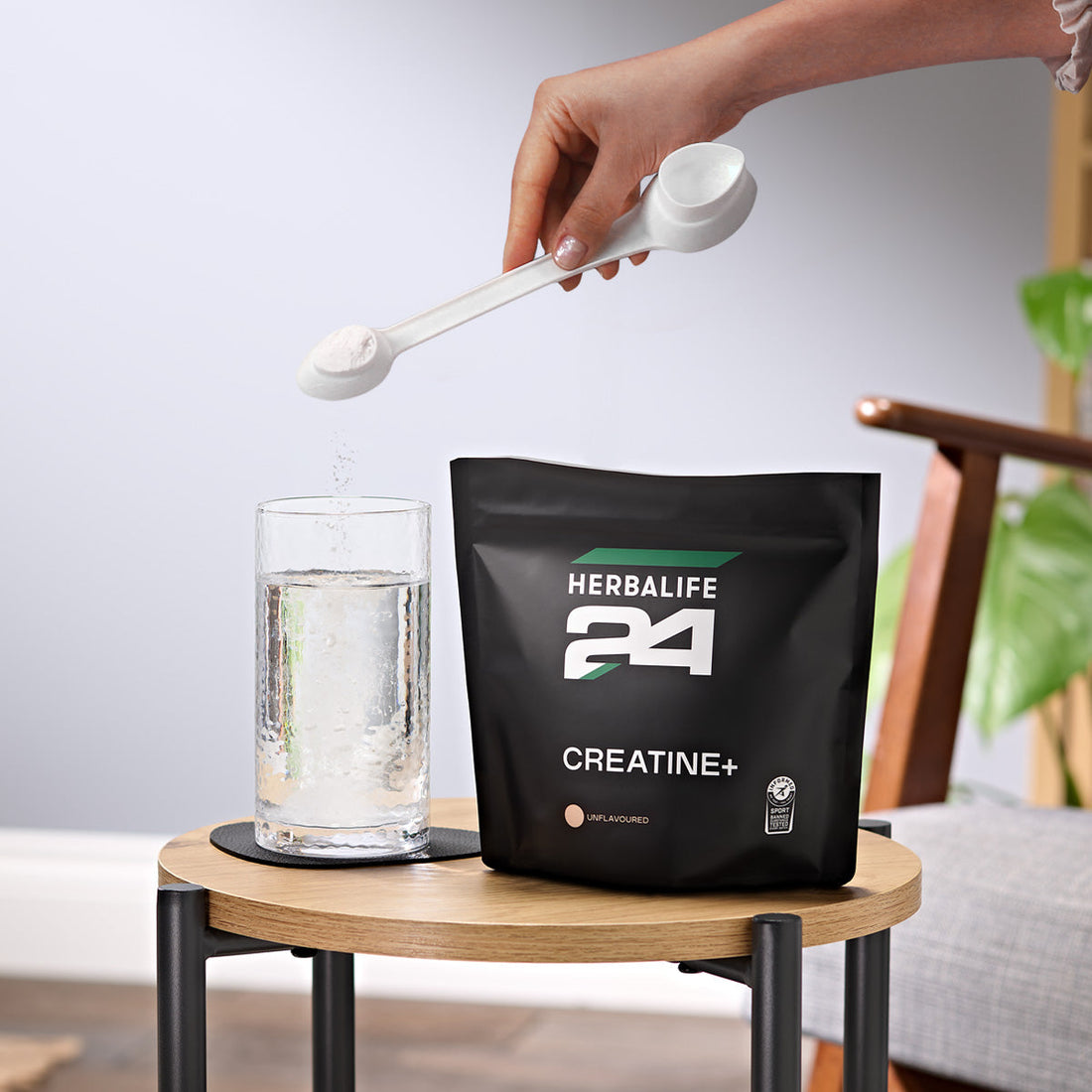 Mixing a daily serving of Herbalife24 Creatine+ into a glass of water